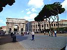 Via triumphalis, south side of the Arch of Constantine and Colosseum (exterior of the south side of the inner wall) seen from the foot of the Palatine hill.