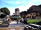 Arch of Augustus foundations and  Temple of Vesta, Forum Romanum in Rome, the Palatine Hill to right