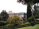 Palace of the Governatorate and Vatican City railway station to r., northeastern Rome in background. View from the Papal Gardens.
