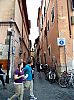 Rome, Via dei Cappellari, well-fed tourists and unused bycicles on a medieval street.
